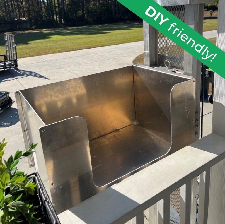 Metallic platform on a porch, labeled DIY friendly, suitable for outdoor home elevators in a sunny yard.