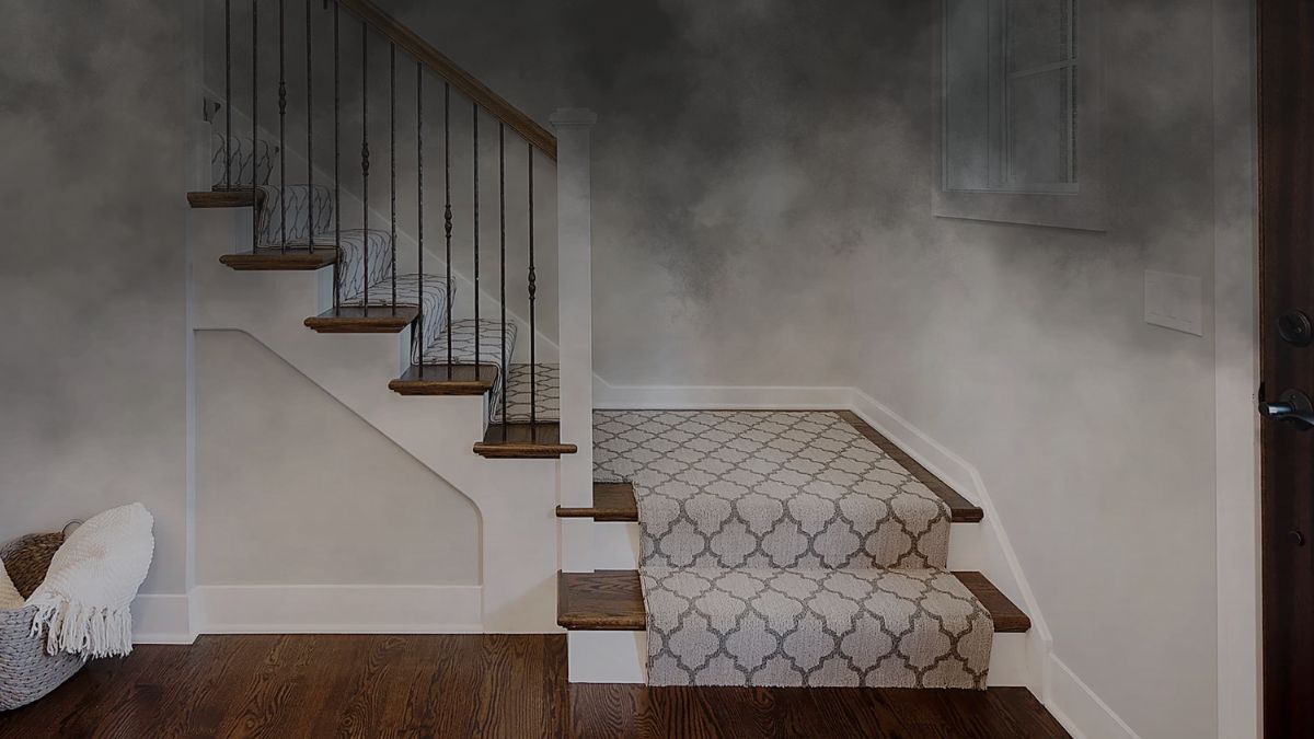 Don’t Let Stairs Become the Scariest Part of Your Home Staircase with patterned carpet and dark wooden steps, adjacent to a wall potentially suitable for home elevators installation.